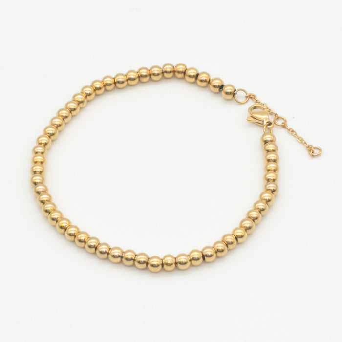 Flaunt Elegance with a Gold Bead Bracelet: The Timeless Accessory